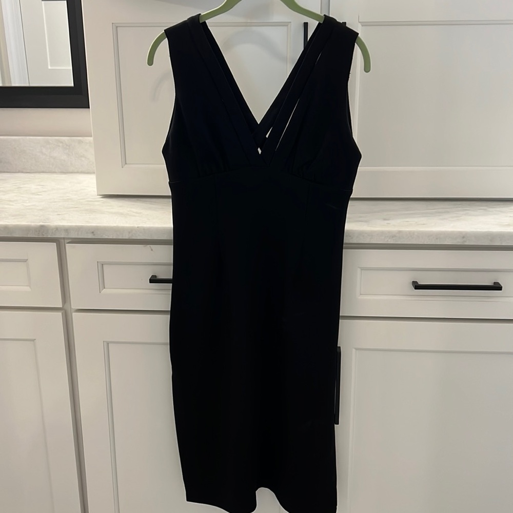 BCBGeneration LBD. Side slit on both sides, sleeveless, mid length